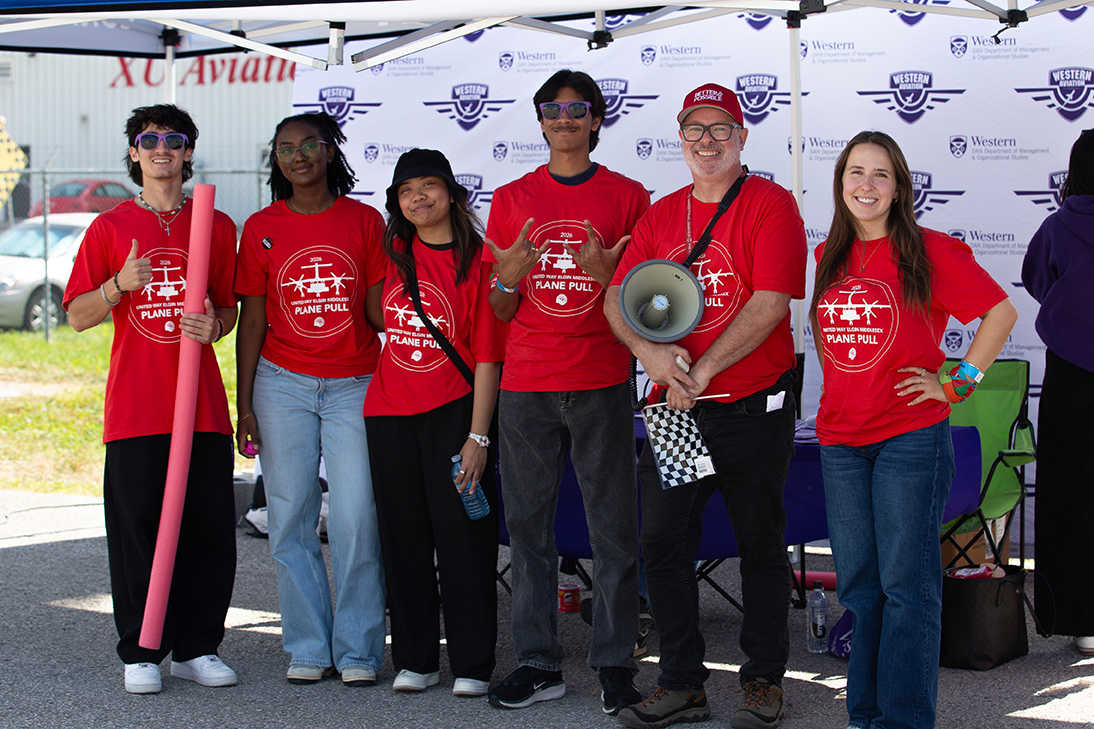 A United Way staff member with CAM students.