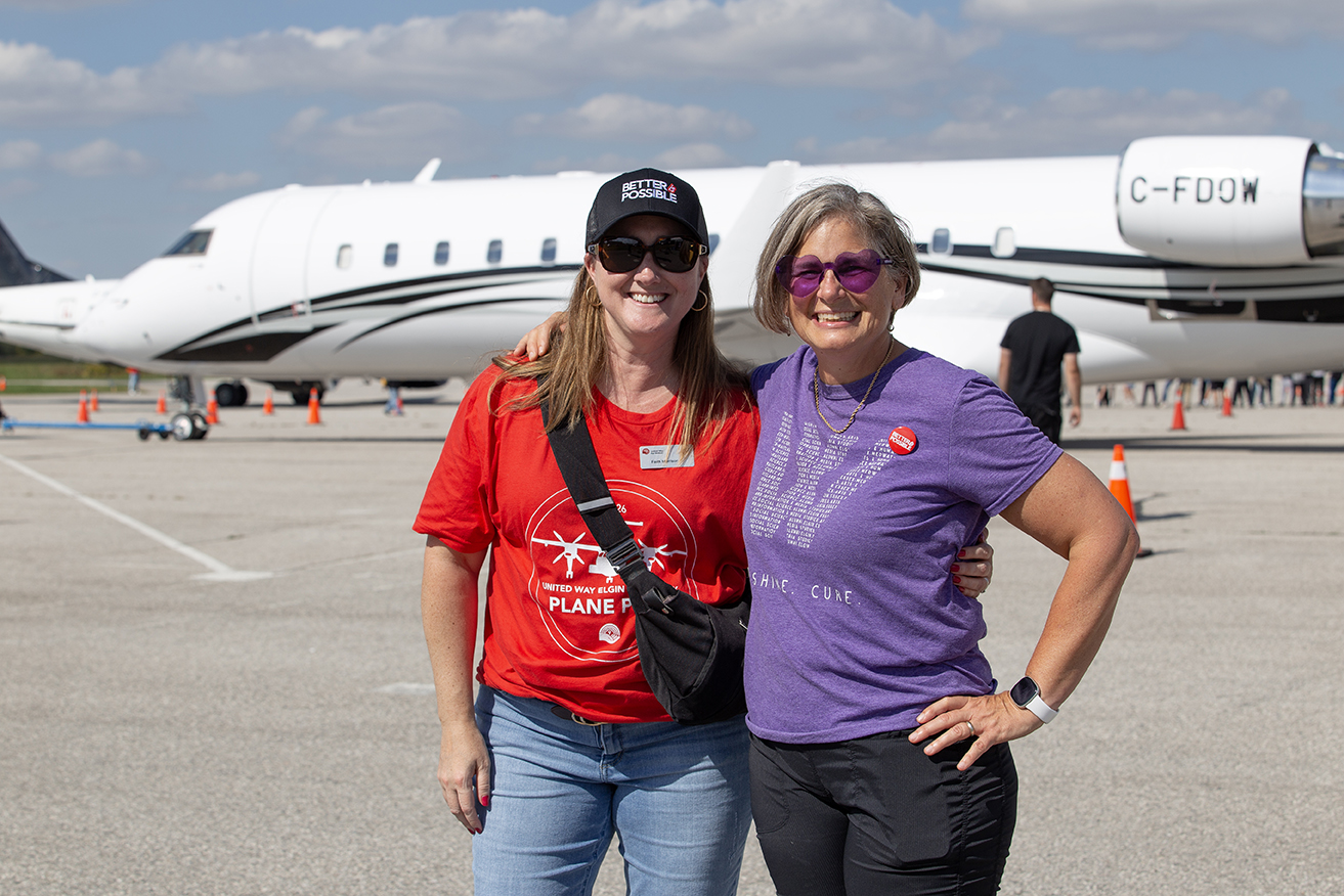 A United Way staff member poses with a Western staff member.