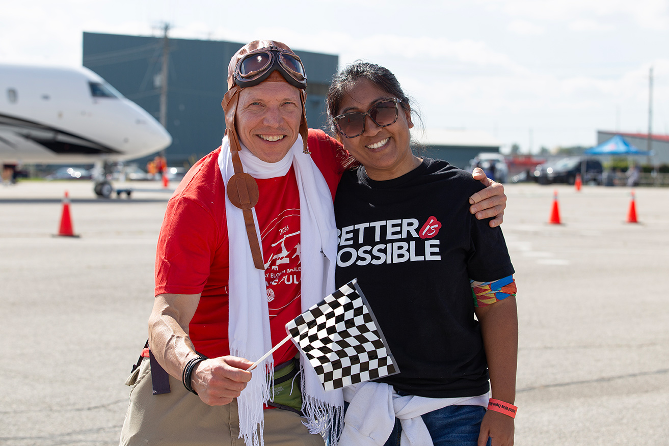 An event volunteer with a Western staff member.