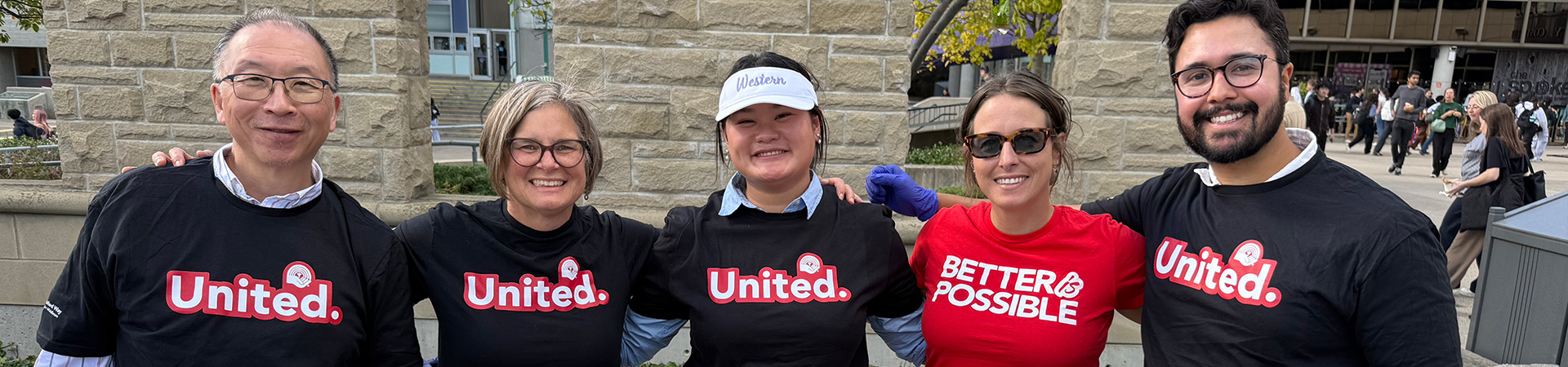 Staff volunteers pose for a photo at the chili kickoff event
