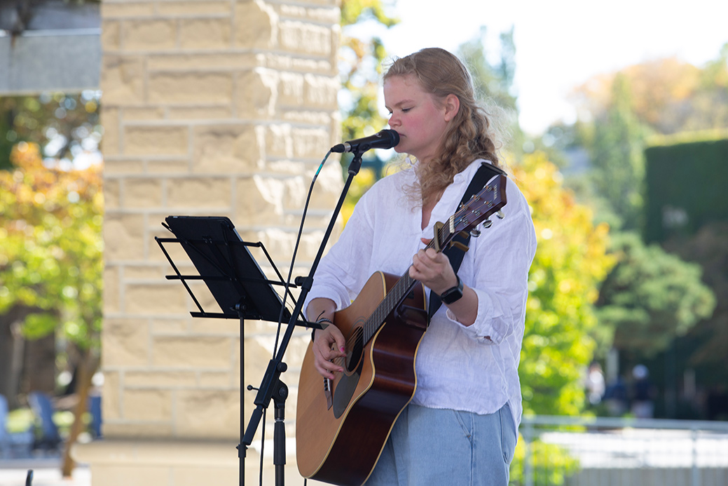 Live musician with a guitar.