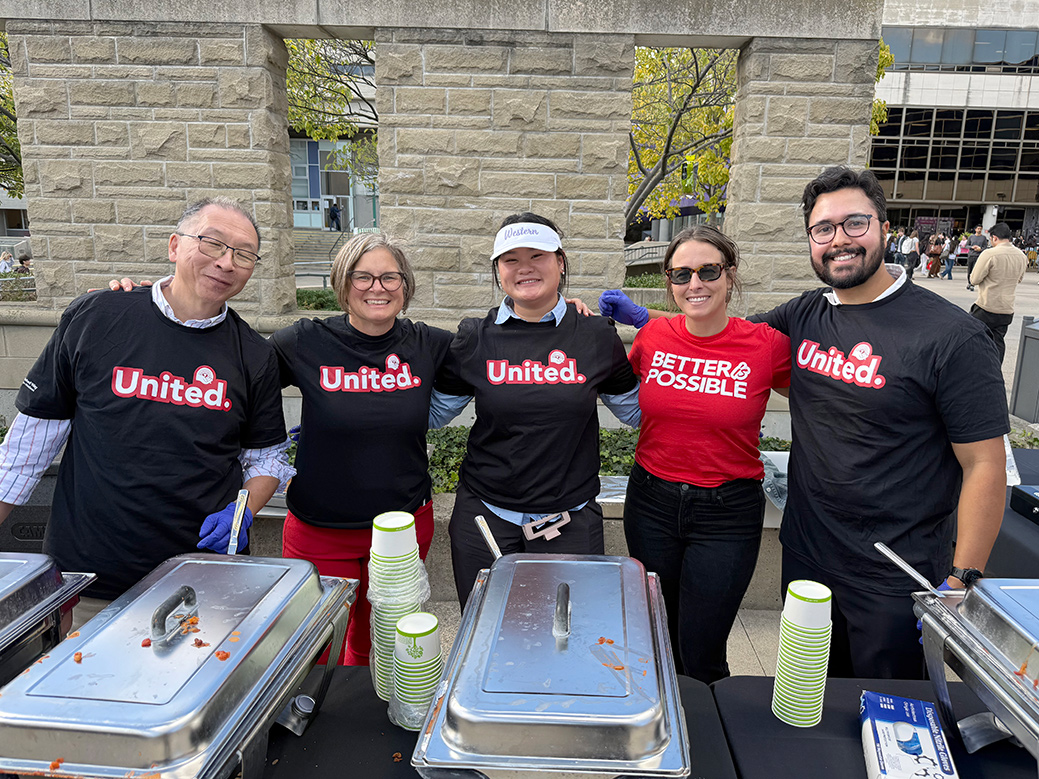 Volunteers serving chili